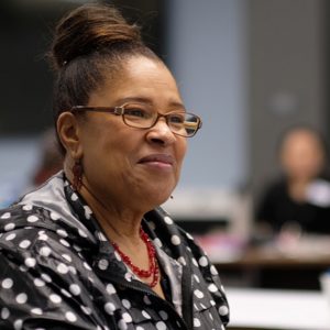 An educator smiling
