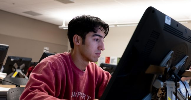 Student seated at a computer