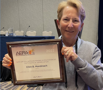 Photo of Ellen Mandinach receiving award