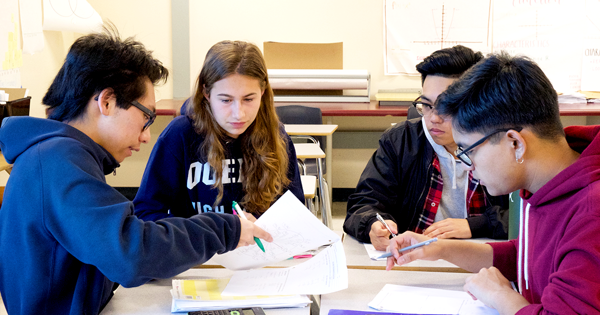 students review an assignment together in class