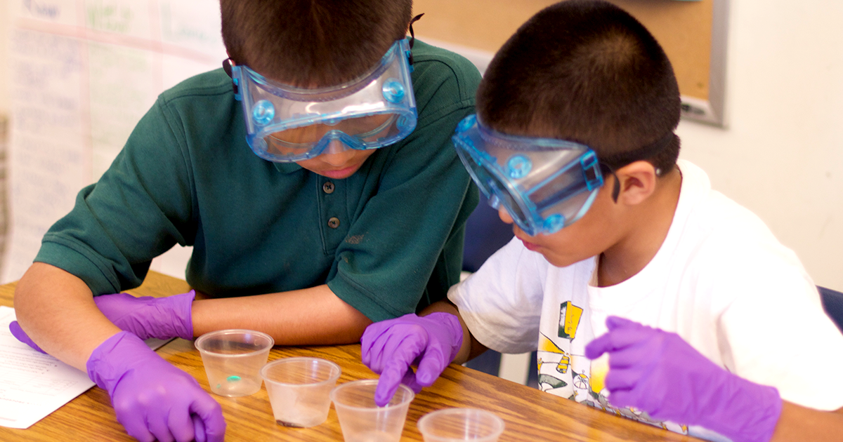 Two students doing a science experiment